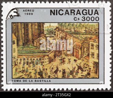 Timbre-poste annulé imprimé par le Nicaragua, qui montre la prise de la Bastille, bicentenaire de la Révolution française, vers 1989. Banque D'Images