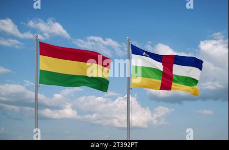 Drapeaux de la République centrafricaine et de la Bolivie agitant ensemble dans le vent sur un ciel nuageux bleu, concept de relation entre deux pays Banque D'Images