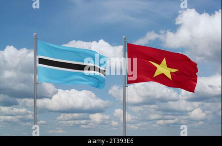 Drapeaux du Vietnam et du Botswana agitant ensemble dans le vent sur un ciel nuageux bleu Banque D'Images