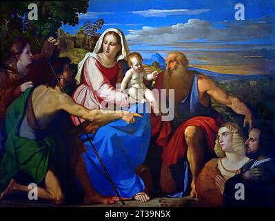Sacra Conversazione - conversation sacrée avec les donateurs 1525 par Palma Vecchio 1525 Musée, Italie. Palma il Vecchio ( Jacopo Negretti ) Italien. Palma Vecchio, né Jacopo Palma et également connu sous le nom de Jacopo Negretti, était un peintre vénitien de la haute Renaissance italienne. Jacopo Negretti, Palma il Vecchio ,1480-1528, Italien , Florence Banque D'Images