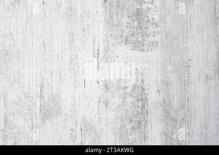 Dessus de table blanc avec impression de veines grises, fond de bois patiné, texture abstraite de gros plan Banque D'Images