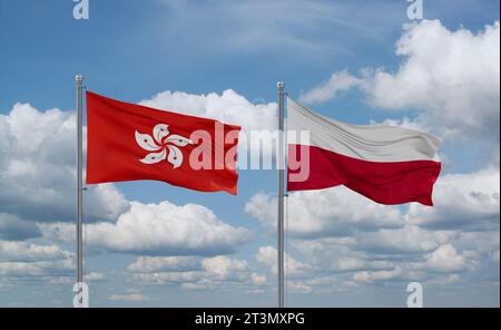 Drapeaux de la Pologne et de Hong Kong agitant ensemble dans le vent sur un ciel nuageux bleu, concept de relation entre deux pays Banque D'Images