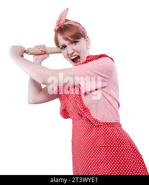 Femme au foyer de style vintage agressif battant quelqu'un avec un rouleau à pâtisserie et criant Banque D'Images