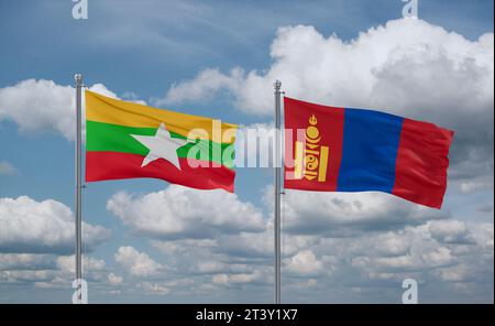 Drapeaux Mongolie et Myanmar agitant ensemble dans le vent sur ciel nuageux bleu, concept de relation entre deux pays Banque D'Images