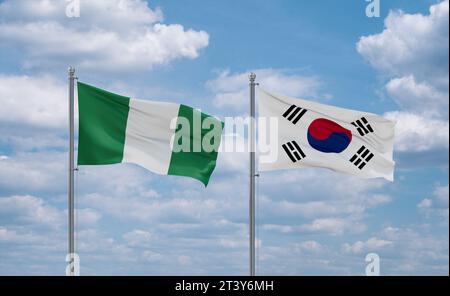 Drapeaux de la Corée du Sud ou de la République de Corée ou de la République de Corée et du Nigeria agitant ensemble dans le vent sur un ciel nuageux bleu, concept de relation entre deux pays Banque D'Images