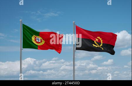 Drapeaux du Portugal et de l'Angola agitant ensemble dans le vent sur un ciel nuageux bleu Banque D'Images