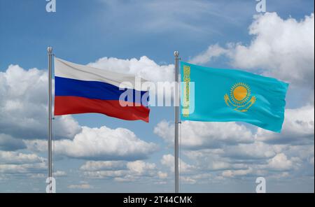 Drapeaux du Kazakhstan et de la Russie agitant ensemble dans le vent sur ciel nuageux bleu, concept de relation entre deux pays Banque D'Images