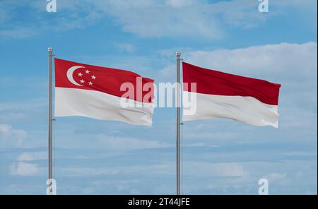 Drapeaux de l'Indonésie et de Singapour agitant ensemble sur un ciel nuageux bleu, concept de relation entre deux pays Banque D'Images