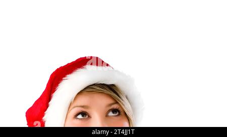 Femme dans le chapeau de noël. Femme dans la pensée chapeau de noël Banque D'Images