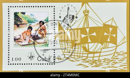 Bloc-feuillet avec timbre-poste oblitéré imprimé par Cuba, qui montre ESPAMER'85. Femme et enfants, vers 1985. Banque D'Images