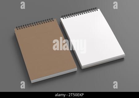 Maquette d'ordinateur portable. Fermez et ouvrez le couvercle de papier brun vierge du carnet. Bloc-notes en spirale sur fond gris. illustration 3d. Banque D'Images