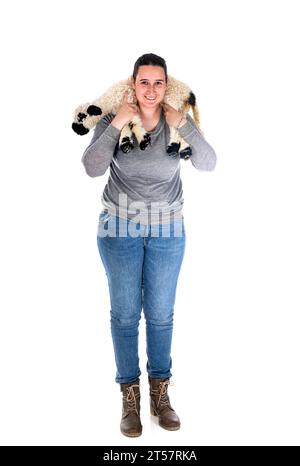 Agneau Valais blacknose et femme paysanne en face de fond blanc Banque D'Images