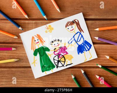 Enfants handicapés amis dessinés avec des crayons Banque D'Images