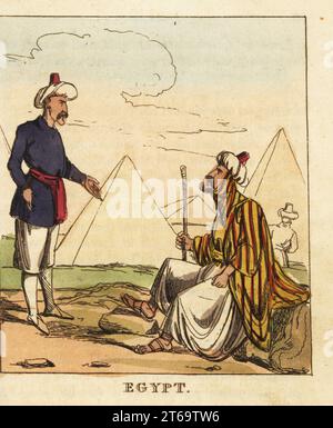 Costumes de l'Eyalet d'Egypte, 19e siècle. Deux égyptiens devant les pyramides. Turc ottoman en turban, robe rayée, pantoufles larges et sandales. Mamelouk ou soldat en turban et uniforme. Gravure sur cuivre colorée à la main du monde en miniature, ou Panorama des costumes, Manners & Customs of All Nations, John Bysh, Londres, 1825. Banque D'Images