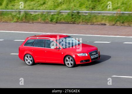 2006 Audi A4 avant S Line TDI 140 TDI TDV 140 Red car Estate Diesel 1986 cc ; voyageant à grande vitesse sur l'autoroute M6 dans le Grand Manchester, Royaume-Uni Banque D'Images