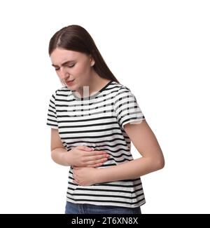 Jeune femme souffrant de douleurs à l'estomac sur fond blanc Banque D'Images
