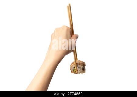 Sushi unagi dans une main de femme isolé sur un fond blanc. Banque D'Images