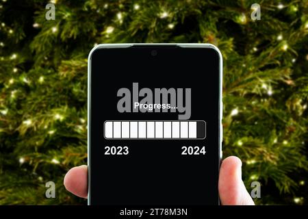 Planification des activités jusqu'en 2024. La barre de téléchargement virtuelle avec barre de progression de chargement pour la Saint-Sylvestre et changement de l'année 2023 à 2024. Affaires, stratégie Banque D'Images