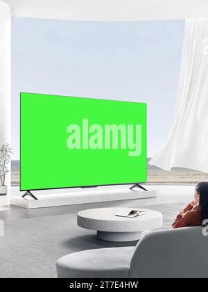 Les gens regardent et apprécient à côté de la télévision, moniteur avec écran vert Banque D'Images