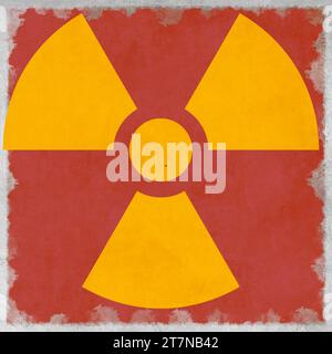 Énergie nucléaire radioactive (rayonnement atomique ionisant) forme de symbole jaune rond peint sur fond rouge de texture de mur de ciment de béton massif. Nucle Banque D'Images