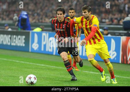 Kaka de l'AC Milan affronte Gerard pique du FC Barcelone lors du match de football H de l'UEFA Champions League 2013/2014 entre l'AC Milan et le FC Barcelone le 22 octobre 2013 à Milan, en Italie. Photo Massimo Cebrelli / DPPI Banque D'Images