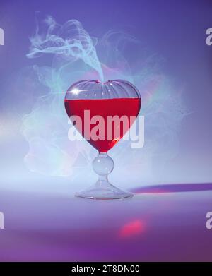 Potion d'amour en forme de cœur dans un flacon en verre pour une célébration romantique de la Saint-Valentin - gros plan lumineux et gai avec des tons rouges et bleus éclatants Banque D'Images