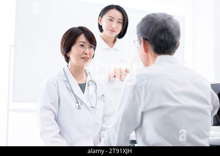 patient and doctor in examination room Stock Photo