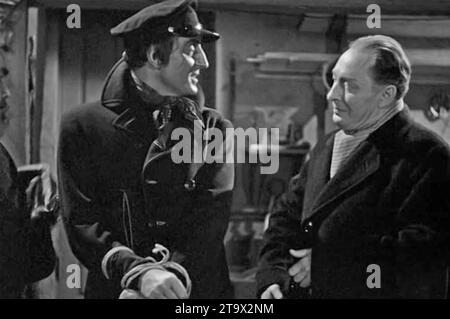 SHERLOCK HOLMES ET L'ARME SECRÈTE 1942 Universal Pictures film avec Basil Rathbone à gauche et Lionel Atwill Banque D'Images