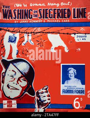 Pochette de partition pour (We're Gonna Hang Out) The Washing on the Siegfried Line, écrite par Jimmy Kennedy et Michael Carr, publiée par Peter Maurice Music Co. Ltd., Londres, 1939. Interprétée avec beaucoup de succès par Florrie Forde, la chanson comique de temps de guerre satirisée la ligne défensive Siegfried de l'Allemagne et est devenue une chanson populaire stimulant le moral en Grande-Bretagne pendant les premiers mois de la première Guerre mondiale. L'œuvre d'art audacieuse reflète à la fois l'humour et la propagande dans la musique populaire des années 1930–40. Banque D'Images
