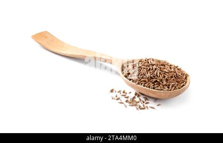 Cuillère de graines de carvi aromatique (cumin persan) isolées sur blanc Banque D'Images