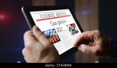 Prix du gaz marché de l'énergie et carburant journal quotidien d'affaires lecture sur l'écran d'ordinateur tablette mobile. Écran tactile homme avec les titres nouvelles abstrait con Banque D'Images