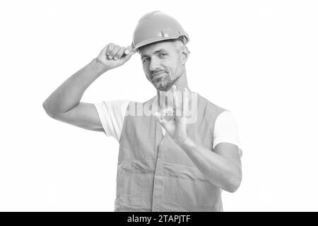 photo de l'homme ouvrier portant un gilet réfléchissant, ok. homme ouvrier isolé sur blanc. homme ouvrier dans le studio blanc. homme ouvrier sur fond. Banque D'Images