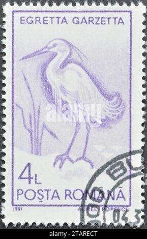 Timbre-poste annulé imprimé par la Roumanie, qui montre la petite Egret (Egretta garzetta), vers 1991. Banque D'Images