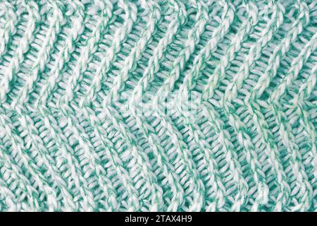 Fond textile Jersey , tissu de laine tricoté blanc vert mélange. Tricot en laine, pull, texture de surface de pull, structure textile, tissu surf Banque D'Images