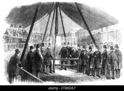 Lord Berners pose la première pierre de l'Agricultural Hall, Islington, [Londres], 1861. Le bâtiment '...prendrait la place du bazar Baker-Street pour l'exposition de Noël du Smithfield Cattle Club, et pour les réunions et autres fins liées à la promotion de l'amélioration agricole... Le bâtiment occupera une vaste zone dans Liverpool-Road, mais à quelques centaines de mètres de l'Angel à Islington. Sa capacité sera beaucoup plus grande que celle du bazar Baker-Street, et il contiendra le logement le plus ample pour l'exposition de bovins, moutons, porcs, a Banque D'Images