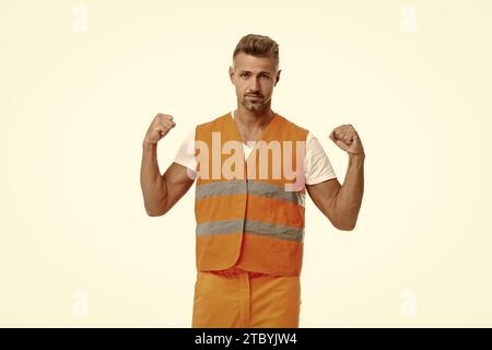 photo d'un superviseur homme fort portant une veste réfléchissante. homme superviseur isolé sur blanc. homme superviseur dans le studio blanc. homme superviseur en arrière-plan Banque D'Images