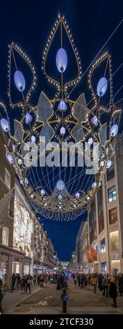 Londres, Royaume-Uni. 11 décembre 2023. Une soirée animée dans le centre de Londres avec des milliers de personnes regardant les impressionnantes décorations de Noël à New Bond Street. Crédit : Malcolm Park/Alamy Banque D'Images