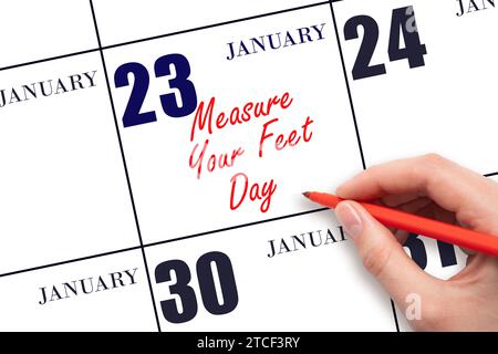Janvier 23. Texte d'écriture à la main mesurez vos pieds jour à la date du calendrier. Enregistrez la date. Vacances. Concept du jour de l'année. Banque D'Images