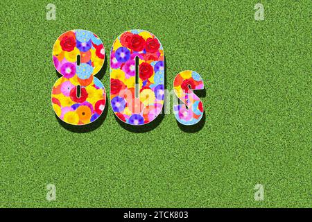 Graphique années 80, années 80, années 1980, avec des fleurs colorées écrites sur un fond vert Banque D'Images