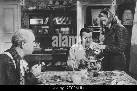 Francis Pierlot, George Brent et Joan Fontaine jouent dans The Affairs of Susan (1945). Le film se concentre sur Susan, interprétée par Fontaine, alors qu'elle navigue dans ses relations amoureuses, avec Brent et Pierlot jouant des rôles clés dans sa vie amoureuse complexe. Banque D'Images