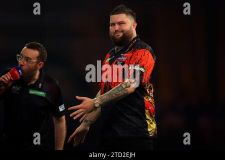 15 décembre 2023, Alexandra Palace, Londres, Angleterre ; 2023/24 PDC Paddy Power World Darts Championships Day 1 ; Michael Smith réagit alors qu'il manque un double lors de son match contre Kevin Doets Banque D'Images