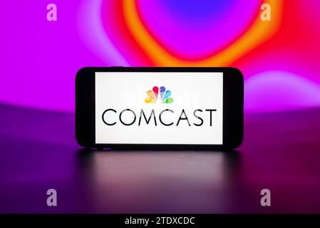 Inde. 19 décembre 2023. Sur cette photo, le logo Comcast est affiché sur l'écran d'un téléphone portable. (Photo Idrees Abbas/SOPA Images/Sipa USA) *** strictement à des fins éditoriales *** crédit : SIPA USA/Alamy Live News Banque D'Images