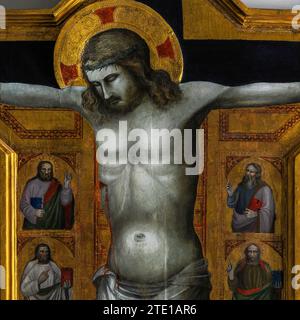 Détail carré d'un grand crucifix peint à la tempera sur bois, censé dater d'environ 1350 et être une œuvre tardive de l'École de Giotto par l'artiste gothique florentin Bonaccorso di Cino. Conservé dans l'église de Santa Maria Primerana sur la Piazza Mino da Fiesole, la place principale de Fiesole, une ville au-dessus de Florence, Toscane, Italie. Banque D'Images