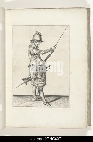 Soldat qui pousse sa poitrine de la charge dans le support sous la course de sa barre (n° 29), ca. 1600, 1597 - 1607 Un soldat, à droite, à droite, qui tient un gouvernail (un certain type d'arme à feu) avec sa main gauche sur sa cuisse gauche et avec sa main droite la canne de chargement dans le support glisse sous la boucle (n° 29), ca. 1600. Planche 29 dans les instructions pour la manipulation de la barre : Corte Onderwysinghe sur l'image de Figuerliicke, intéressé t'rechte Ghebruyck des Roers. Partie des illustrations dans : J. de Gheyn, Weapons Handele of Roers Musquetten and Spiessen, la Haye, 1607. La guerre était Aroun Banque D'Images