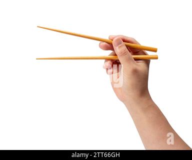 Baguettes en bois à la main isolées sur fond blanc. Banque D'Images