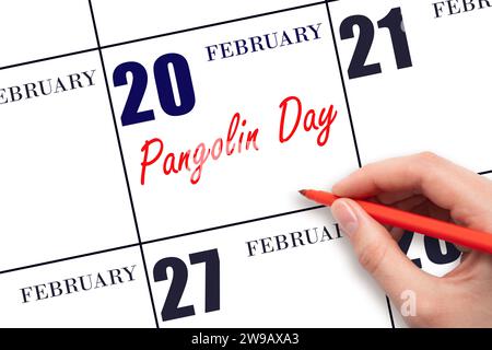 Février 20. Texte d'écriture à la main jour de Pangolin à la date du calendrier. Enregistrez la date. Vacances. Concept du jour de l'année. Banque D'Images