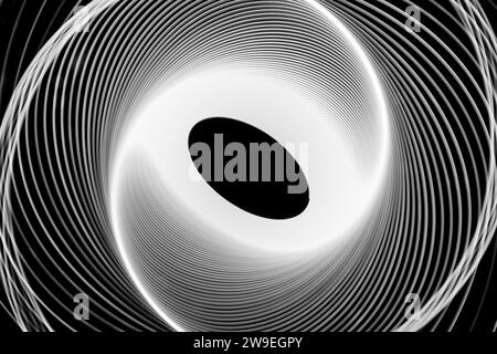 PHOTO : Photographie de peinture légère de spirographes blancs sur fond noir Banque D'Images