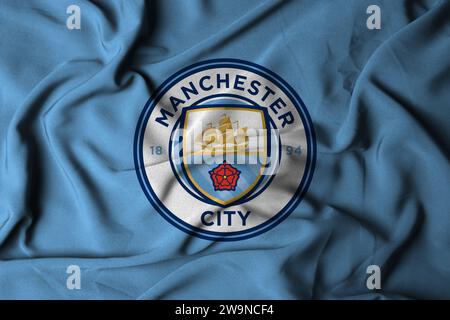 mise au point sélective du logo manchester city. Un club de football professionnel de l'Angleterre dans la ville de Manchester avec une texture de tissu fluide. Banque D'Images