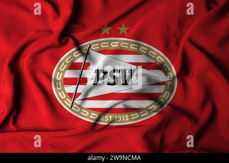 Mise au point sélective du logo PSV. Club de football de la ville d'Eindhoven aux pays-Bas. avec une texture de tissu fluide. Illustration 3D. Banque D'Images