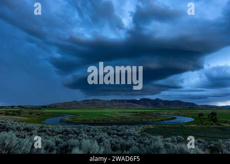 Arcus cumulonimbus storm clouds rolling across farmland Stock Photo
